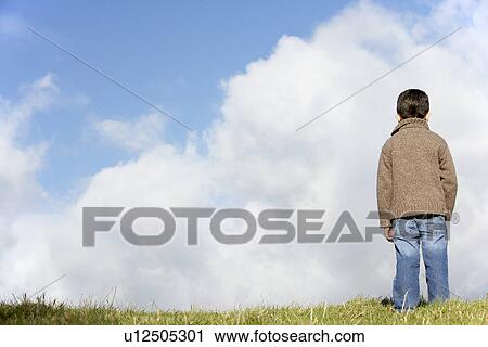 Young Boy Standing In The Park View Large Photo Image Stock Image - Young Boy Standing In The Park. Fotosearch