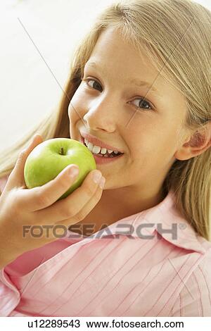 Young Girl Eating An Apple View Large Photo Image Stock Image - Young Girl Eating An Apple. Fotosearch