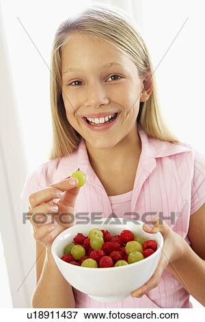 Young Girl Eating Fresh Fruit Salad View Large Photo Image Stock Photo - Young Girl Eating Fresh Fruit Salad. Fotosearch