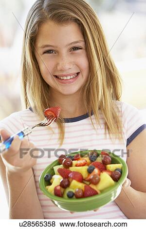Young Girl Eating Fresh Fruit Salad View Large Photo Image Stock Photo - Young Girl Eating Fresh Fruit Salad. Fotosearch