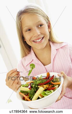 Young Girl Eating Fresh Salad View Large Photo Image Picture - Young Girl Eating Fresh Salad. Fotosearch