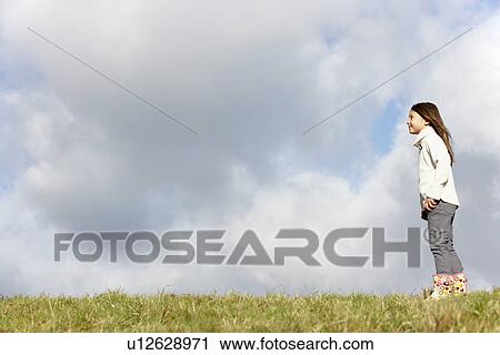 Young Girl Standing In The Park View Large Photo Image Stock Image - Young Girl Standing In The Park. Fotosearch