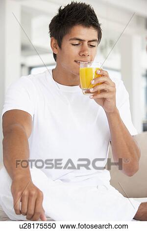 Young Man Drinking Orange Juice View Large Photo Image Stock Image - Young Man Drinking Orange Juice. Fotosearch