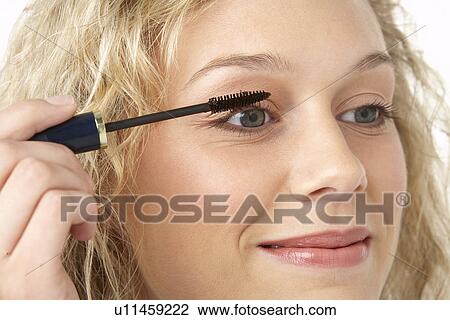 Young Woman Applying Make-Up View Large Photo Image Stock Image - Young Woman Applying Make-Up. Fotosearch