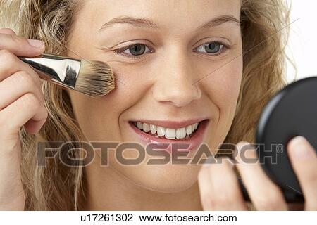 Young Woman Applying Make-Up View Large Photo Image Stock Image - Young Woman Applying Make-Up. Fotosearch
