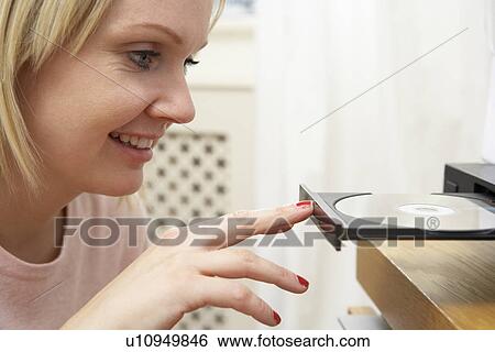 Young Woman Closing DVD Player With Finger View Large Photo Image Stock Photograph - Young Woman Closing DVD Player With Finger. Fotosearch