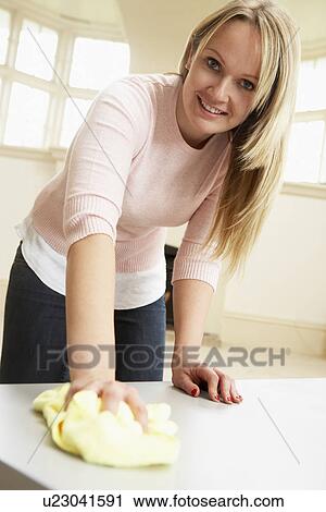 Young Woman Doing Housework View Large Photo Image Stock Image - Young Woman Doing Housework. Fotosearch