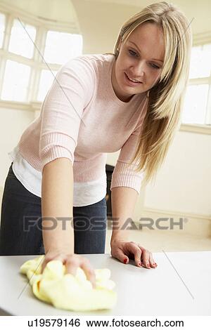 Young Woman Doing Housework View Large Photo Image Stock Photograph - Young Woman Doing Housework. Fotosearch