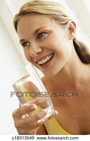 Young Woman Drinking A Glass Of Water View Large Photo Image Stock Photo - Young Woman Drinking A Glass Of Water. Fotosearch
