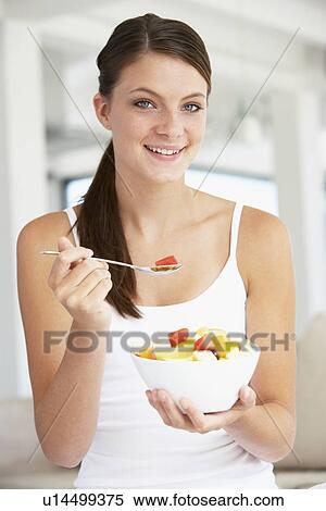Young Woman Eating Fresh Fruit Salad View Large Photo Image Stock Photography - Young Woman Eating Fresh Fruit Salad. Fotosearch