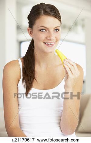 Young Woman Eating Fresh Pineapple View Large Photo Image Stock Photo - Young Woman Eating Fresh Pineapple. Fotosearch