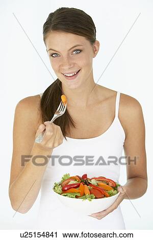 Young Woman Eating Fresh Salad View Large Photo Image Stock Image - Young Woman Eating Fresh Salad. Fotosearch