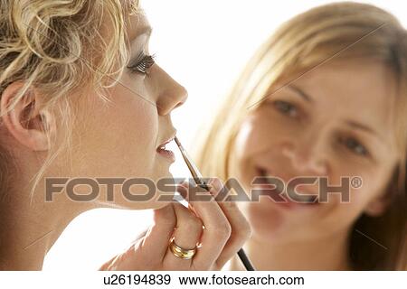 Young Woman Having Her Lipstick Applied View Large Photo Image Stock Photo - Young Woman Having Her Lipstick Applied. Fotosearch