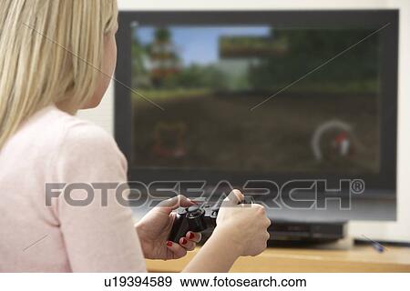 Young Woman Playing With Game Console View Large Photo Image Stock Photo - Young Woman Playing With Game Console. Fotosearch