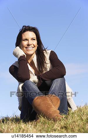 Picture - Young Woman Sitting In Park. Fotosearch