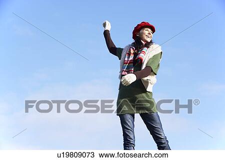 Young Woman Standing In Park View Large Photo Image Stock Image - Young Woman Standing In Park. Fotosearch
