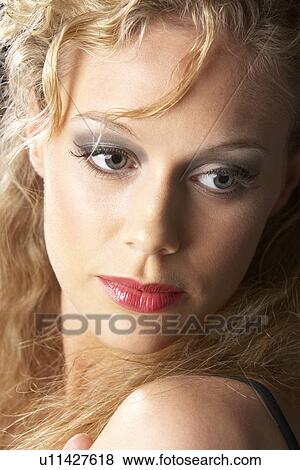 Young Woman Wearing Make-Up, Looking Thoughtful View Large Photo Image Stock Photo - Young Woman Wearing Make-Up, Looking Thoughtful. Fotosearch