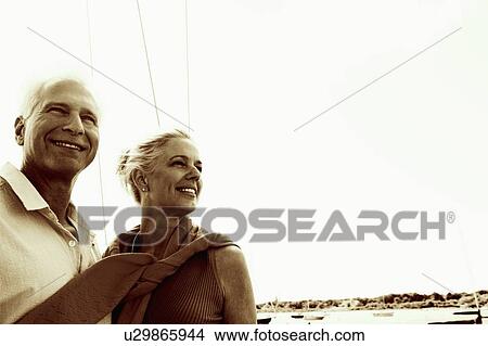 Picture - Close-up of a mature couple smiling. Fotosearch