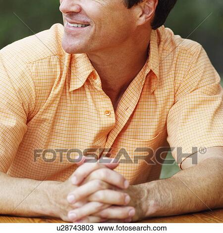 Stock Image - Close-up of a mature man smiling. Fotosearch