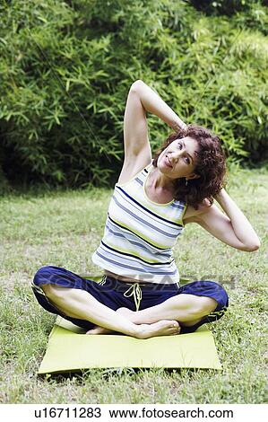 Mature woman exercising on the lawn View Large Photo Image Stock Image - Mature woman exercising on the lawn. Fotosearch