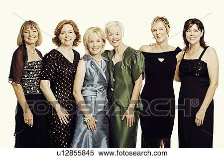 Stock Photography - Portrait of a group of mature women standing together and smiling. Fotosearch