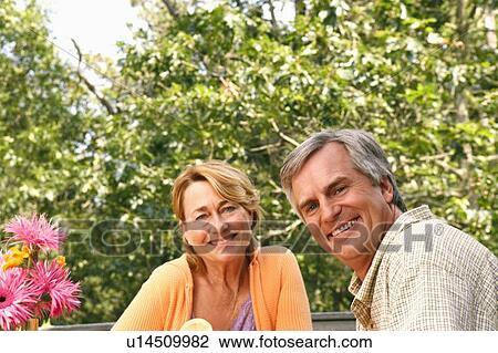 Portrait of a mature couple smiling View Large Photo Image Stock Image - Portrait of a mature couple smiling. Fotosearch