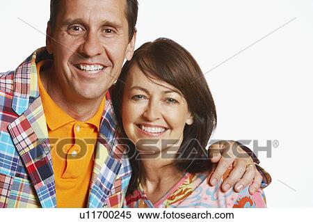 Portrait of a mature man with his arm around a mature woman and smiling View Large Photo Image Stock Photography - Portrait of a mature man with his arm around a mature woman and smiling. Fotosearch
