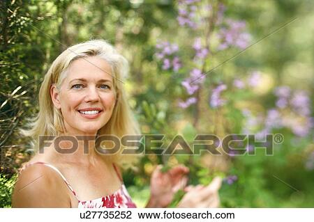 Stock Image - Portrait of a mature woman smiling. Fotosearch