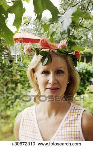 Portrait of a mature woman smiling View Large Photo Image Stock Image - Portrait of a mature woman smiling. Fotosearch