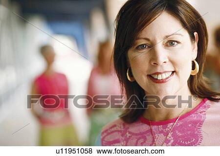 Stock Photo - Portrait of a mature woman smiling. Fotosearch