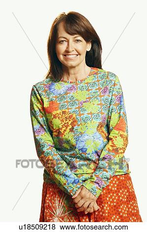Portrait of a mature woman with her hands clasped View Large Photo Image Stock Photo - Portrait of a mature woman with her hands clasped. Fotosearch