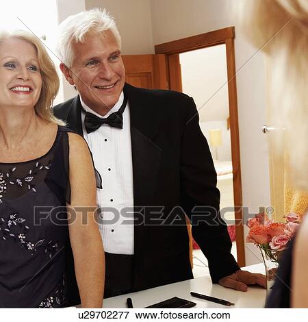 Reflection of a mature couple smiling on a mirror View Large Photo Image Stock Photo - Reflection of a mature couple smiling on a mirror. Fotosearch