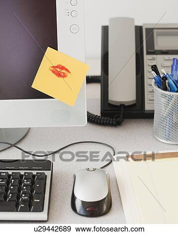 Adhesive note with lipstick kiss on computer monitor View Large Photo Image Stock Photo - Adhesive note with lipstick kiss on computer monitor. Fotosearch