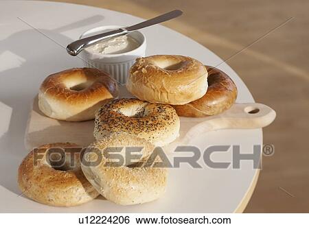 Bagels and creme cheese on table View Large Photo Image Stock Photograph - Bagels and creme cheese on table. Fotosearch