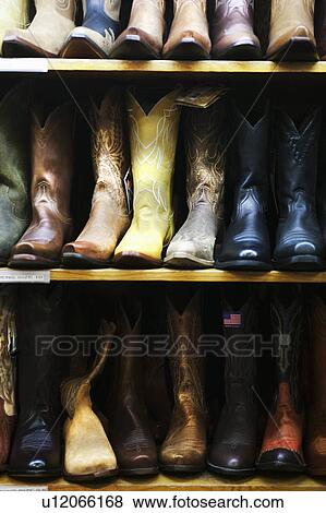 "Boot in row on shelves in shop, Aspen, Colorado, USA " View Large Photo Image Stock Photo - "Boot in row on shelves in shop, Aspen, Colorado, USA ". Fotosearch
