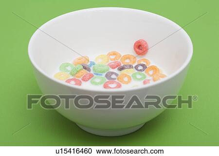 Stock Image - Bowl of colorful cereal rings. Fotosearch