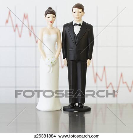Picture - Bride and groom cake toppers by graph. Fotosearch