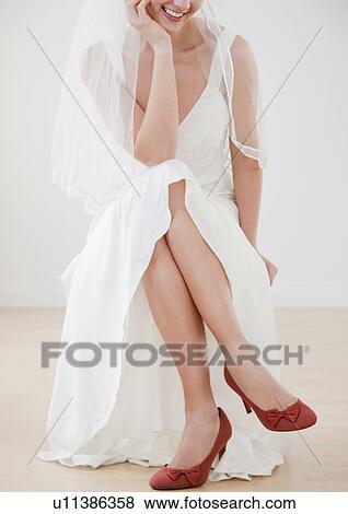 Bride wearing red high heels View Large Photo Image Stock Photo - Bride wearing red high heels. Fotosearch