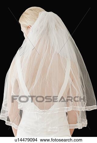 "Bride wearing veil, rear view" View Large Photo Image Picture - "Bride wearing veil, rear view". Fotosearch