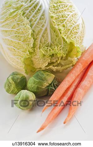 Picture - "Bunch of carrots, brussel sprouts and cabbage". Fotosearch