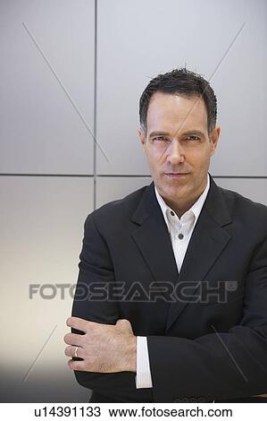 "Businessman against grid wall, portrait" View Large Photo Image Stock Image - "Businessman against grid wall, portrait". Fotosearch