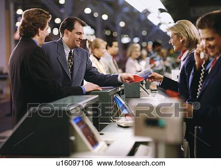 Businessman buying ticket at the airport View Large Photo Image Stock Photograph - Businessman buying ticket at the airport. Fotosearch