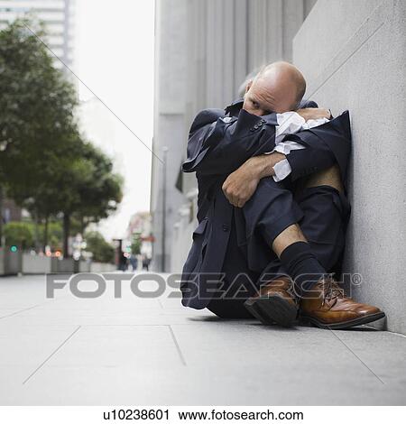 "Businessman wearing torn clothing, sitting on sidewalk, San Francisco, California, USA" View Large Photo Image Stock Image - "Businessman wearing torn clothing, sitting on sidewalk, San Francisco, California, USA". Fotosearch