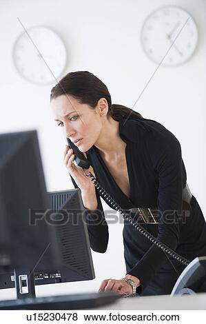 Stock Photo - Businesswoman on phone. Fotosearch