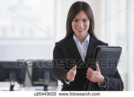 Stock Image - Businesswoman ready to shake hands. Fotosearch