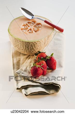Cantaloupe and strawberries View Large Photo Image Picture - Cantaloupe and strawberries. Fotosearch