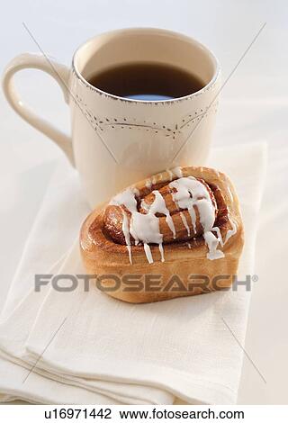 Stock Image - cinnamon bun with coffee. Fotosearch