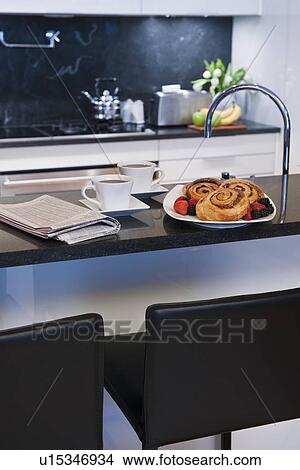 Cinnamon buns on kitchen worktop View Large Photo Image Picture - Cinnamon buns on kitchen worktop. Fotosearch