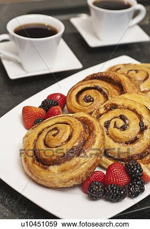 Cinnamon buns on plate View Large Photo Image Stock Photo - Cinnamon buns on plate. Fotosearch