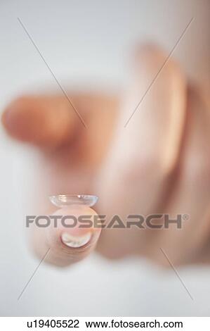 Close-up of contact lens on woman's finger View Large Photo Image Stock Image - Close-up of contact lens on woman's finger. Fotosearch